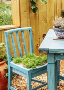 A blue chair with greenery