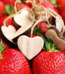 Strawberries with wooden hearts