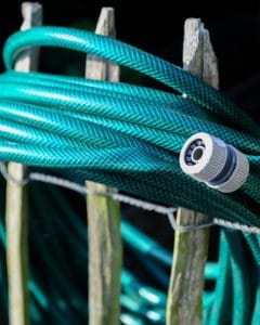 A green garden hose